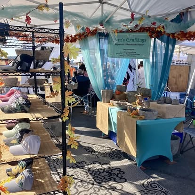 Pam's Craftings booth with fall leaves, caps and planters